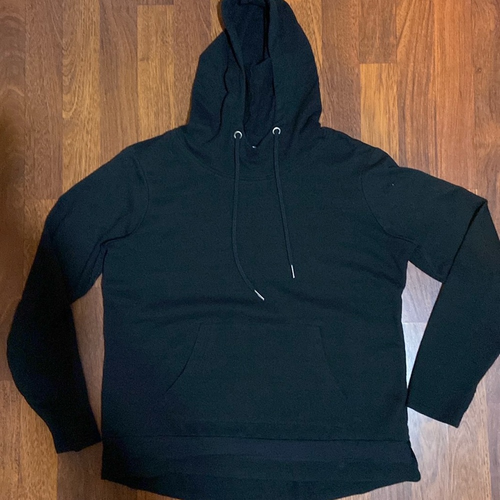 Hooded sweatshirt black that has  a large pocket frontside. Good used condition